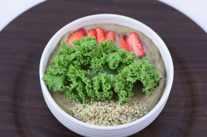 smoothie bowl with strawberries and kale