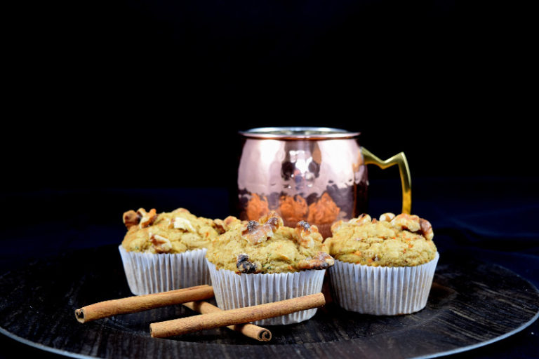 harvest oat muffins with cinnamon next to a copper mule mug