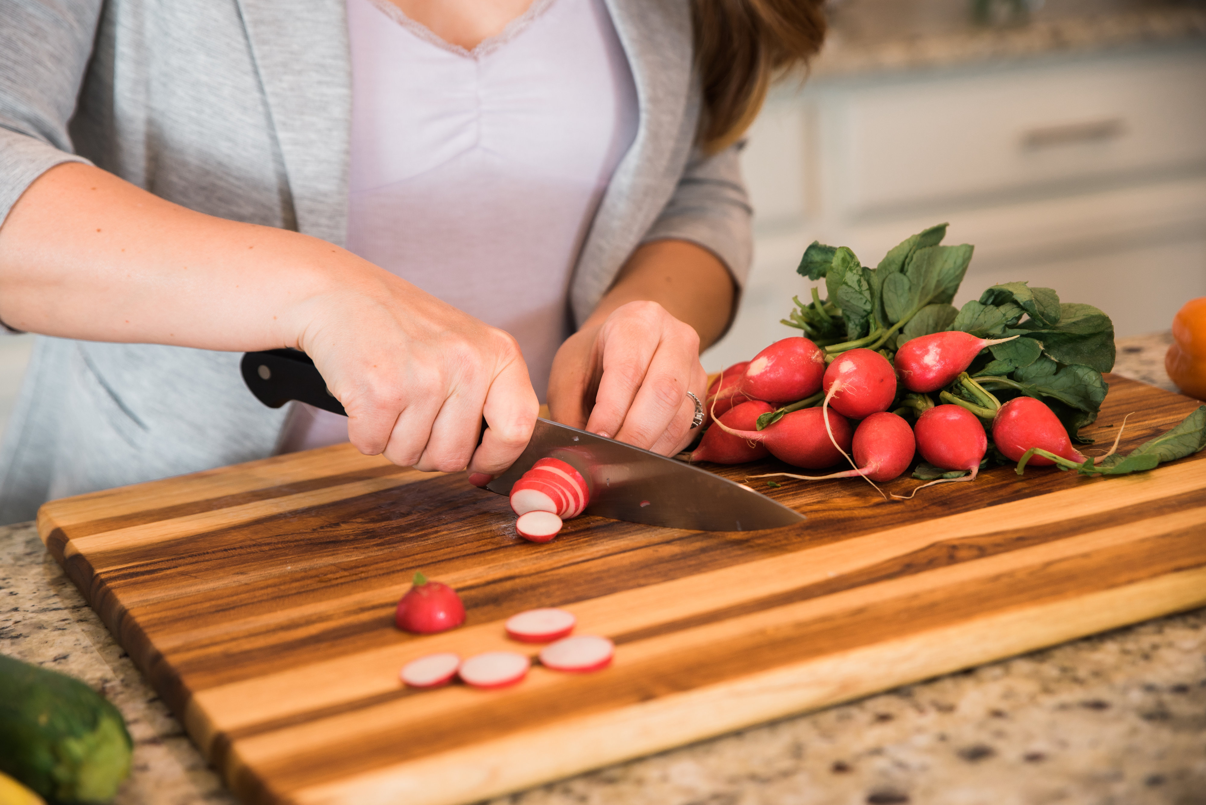 radishes on cutting board