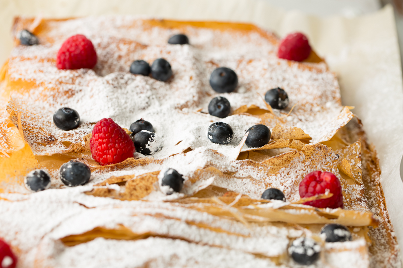 garnishing very berry phyllo bars with berries