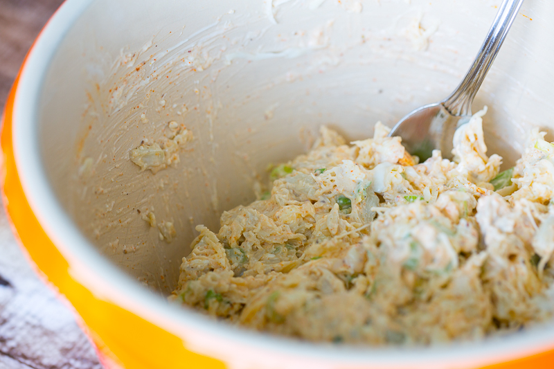 raw warm crab dip in mixing bowl