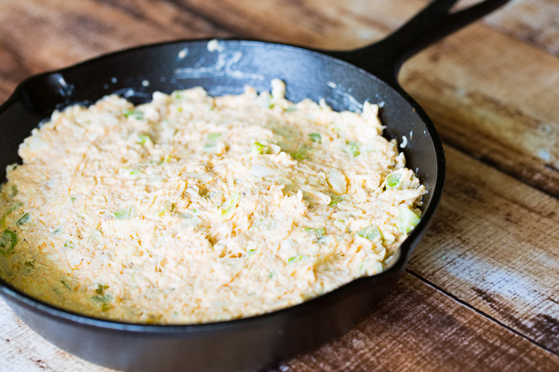 raw crab dip in cast iron skillet