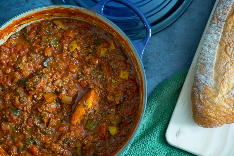 rustic shot of homemade spaghetti sauce recipe in dutch oven