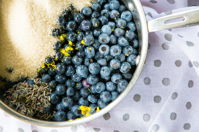blueberries, lemon, and lavender in a pot