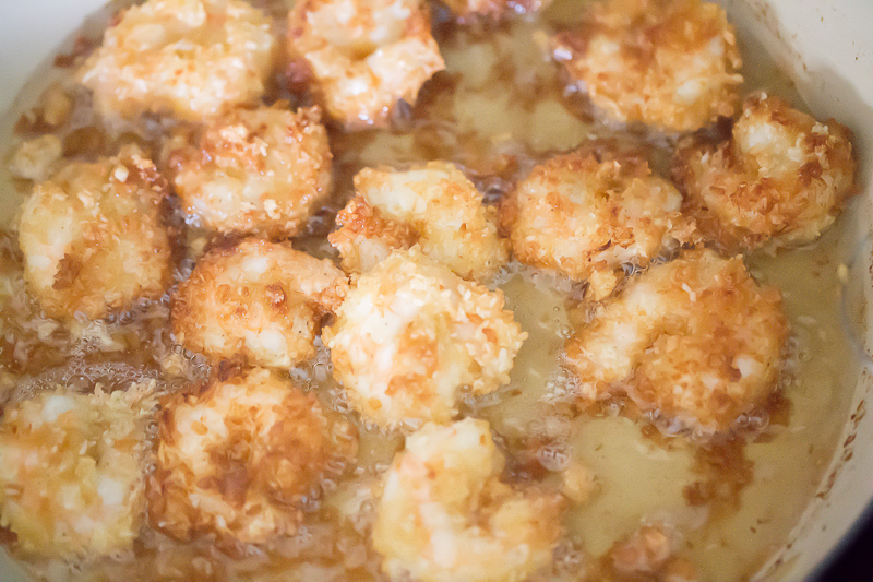 coconut shrimp frying in pan