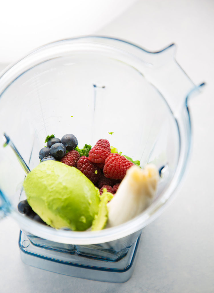 Berries, avocado, and kale in a vitamix 