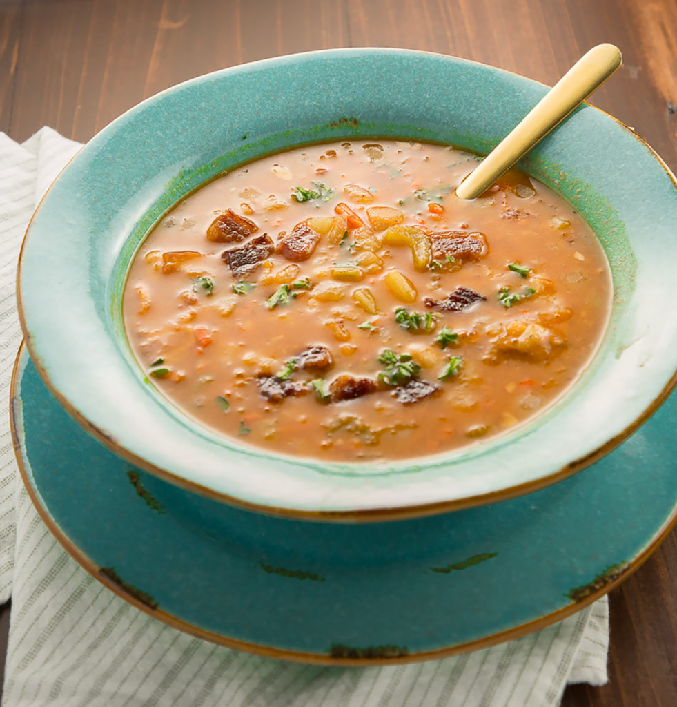 Bean and Bacon soup in a teal bowl