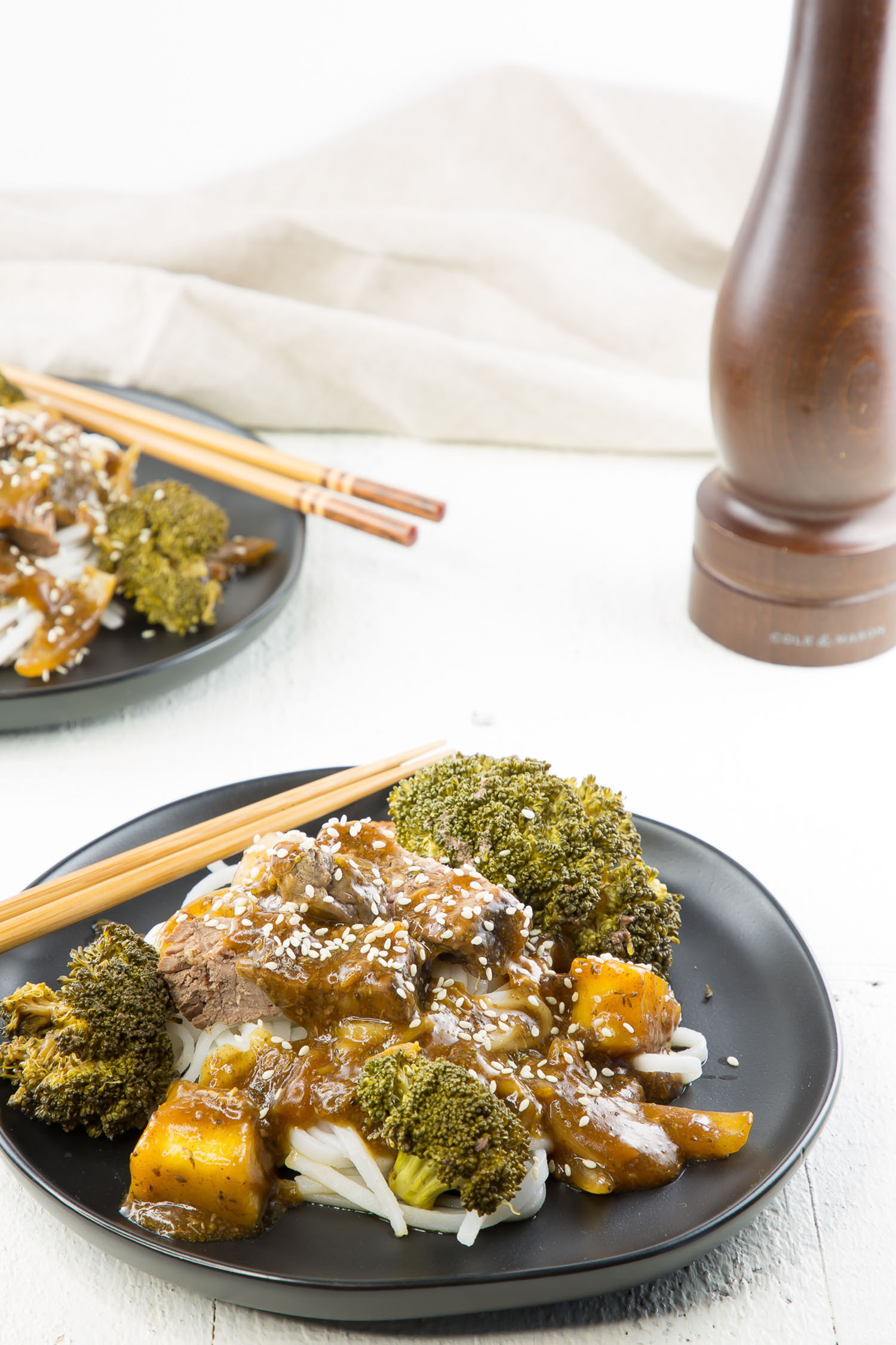 beef and broccoli bowl with chopsticks