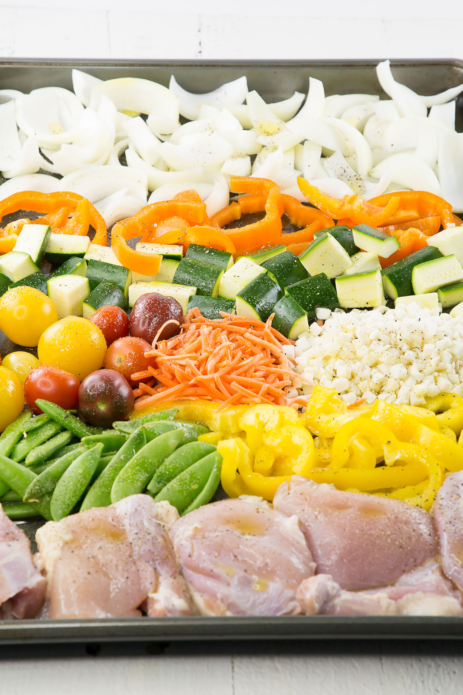 veggies and chicken on a sheet pan