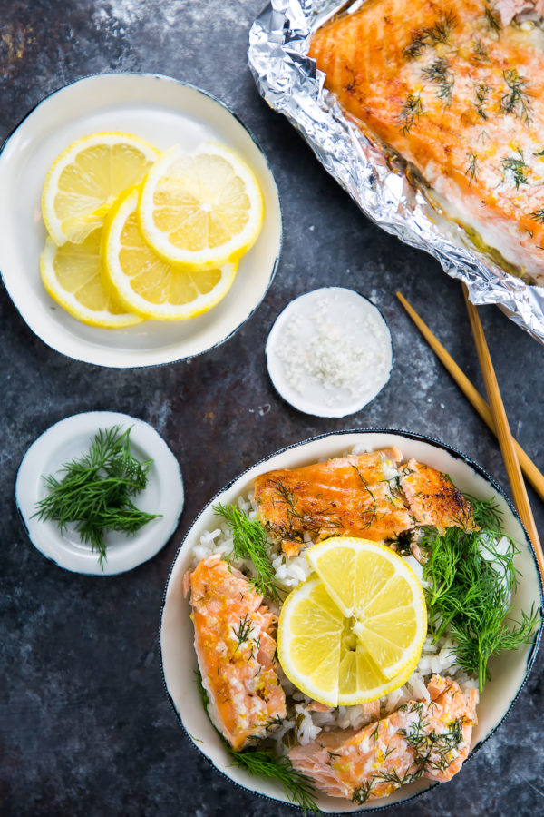 baked salmon in a rice bowl with lemon and dill