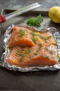 raw alaska king salmon fillets with lemon and dill