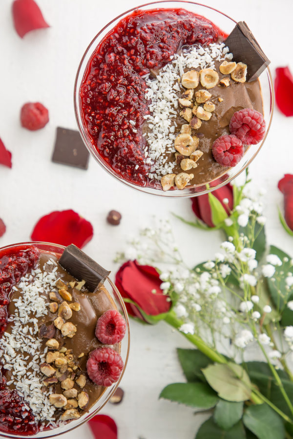 vegan chocolate pudding in a martini glass with rose petals and chocolate