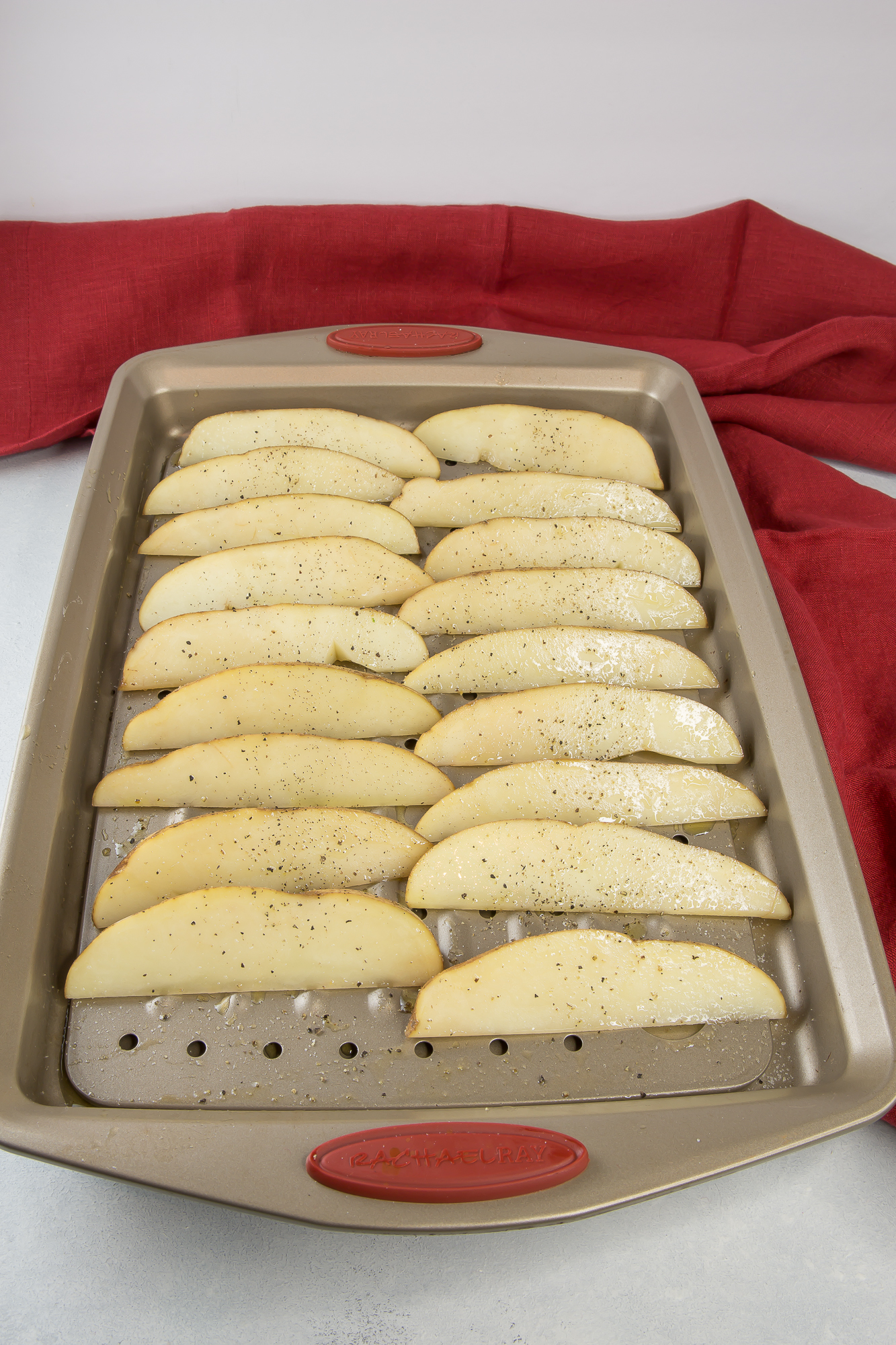 Potato wedges on baking sheet