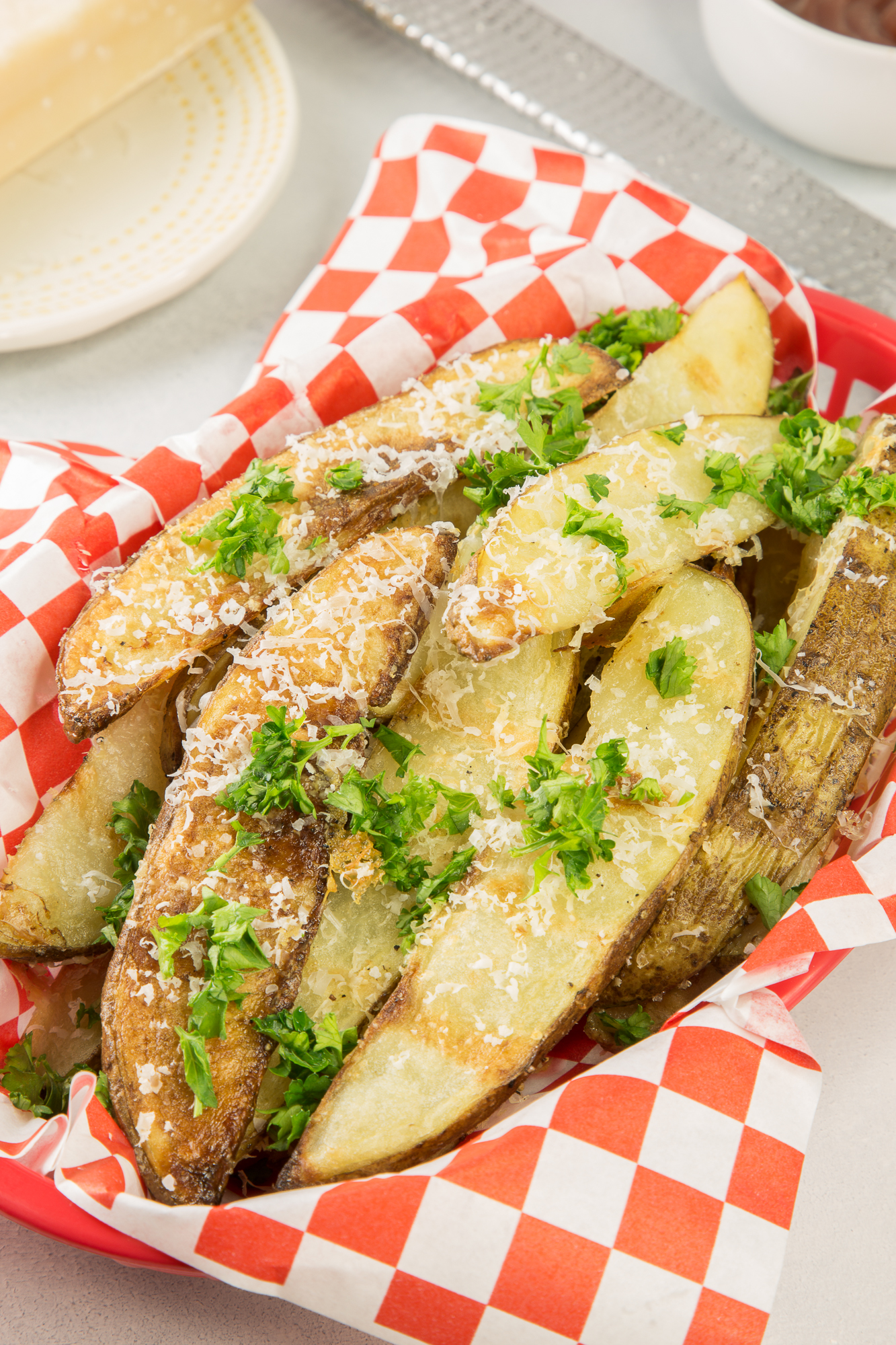 Close up of broasted potato wedges in a basket