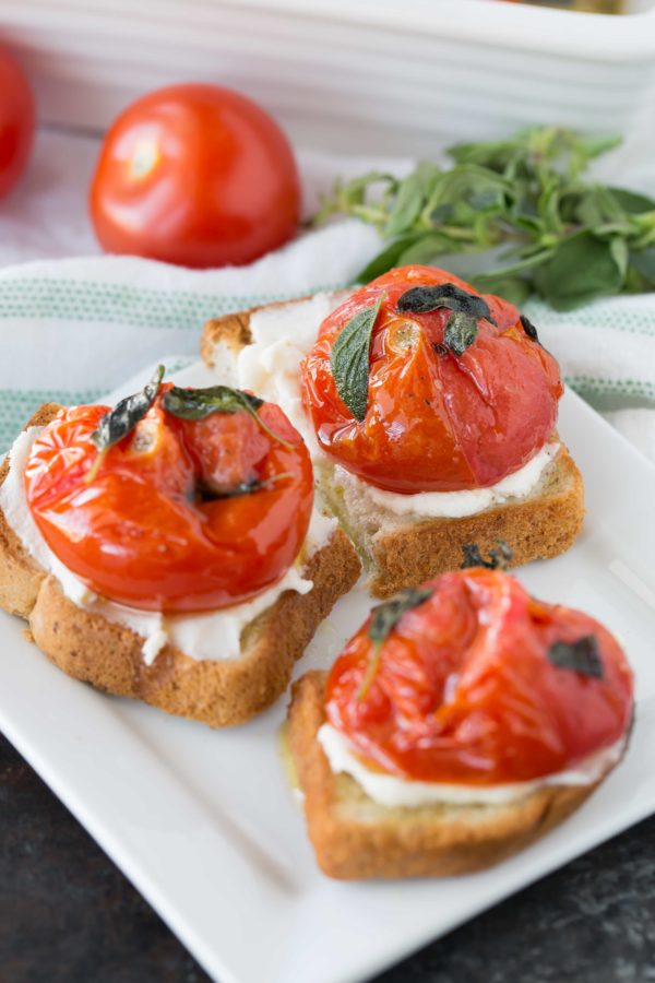 Broiled tomatoes with fresh oregano on toast