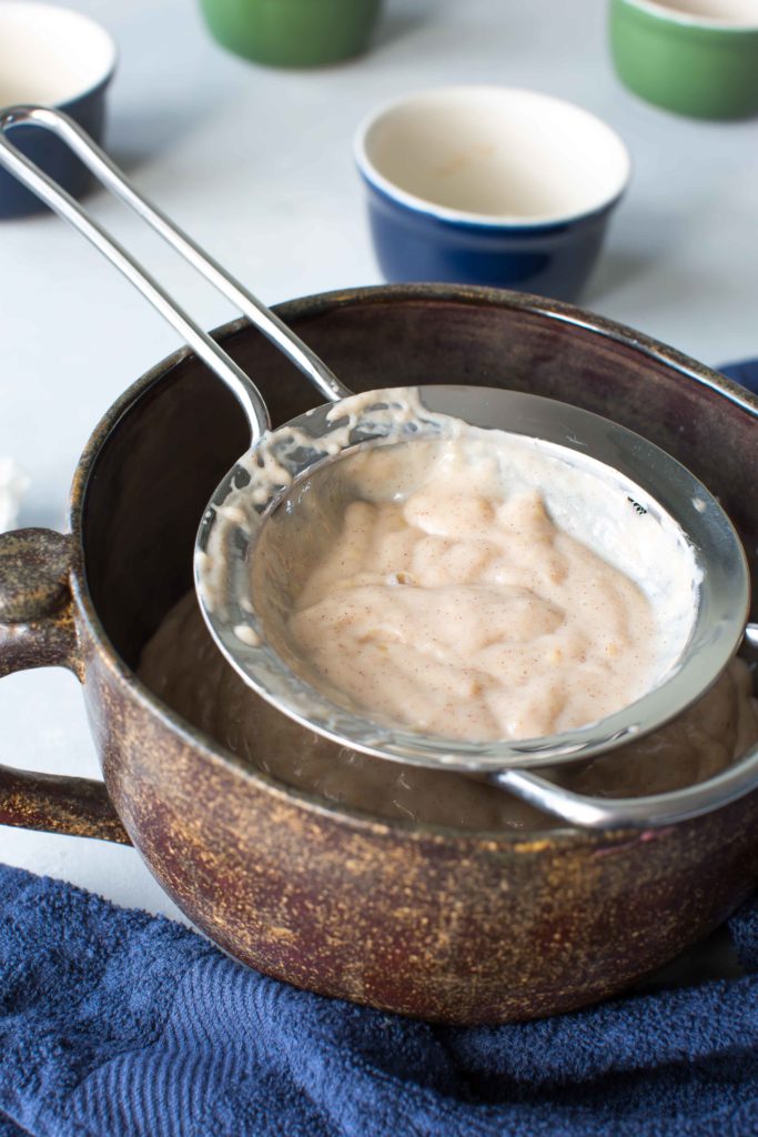 straining honey and cinnamon pudding with caramelized bananas