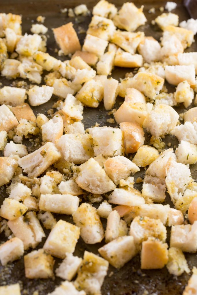 Cubed and dressed bread for garlic parmesan croutons